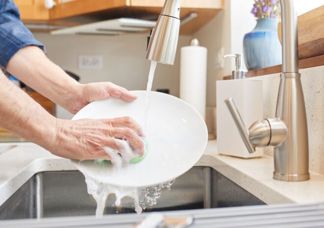washing dishes in sink